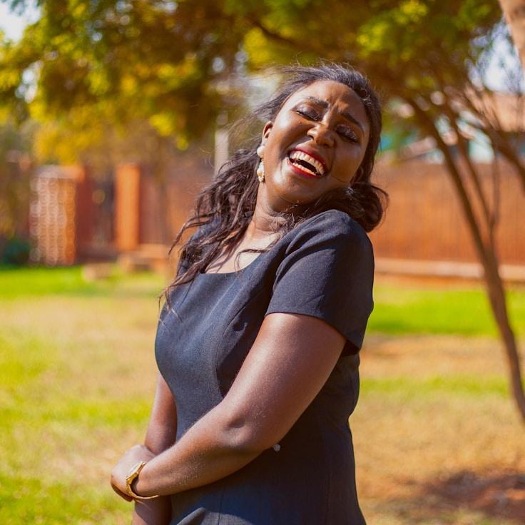 Ava Singh, Lead Design Curator at GardenLatticeTrail, reviewing corporate floral arrangements